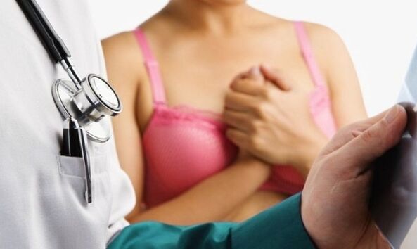 exam by a doctor before breast augmentation